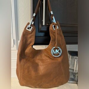Michael Kors Brown soft leather slouch bag with silver hardware.Great condition